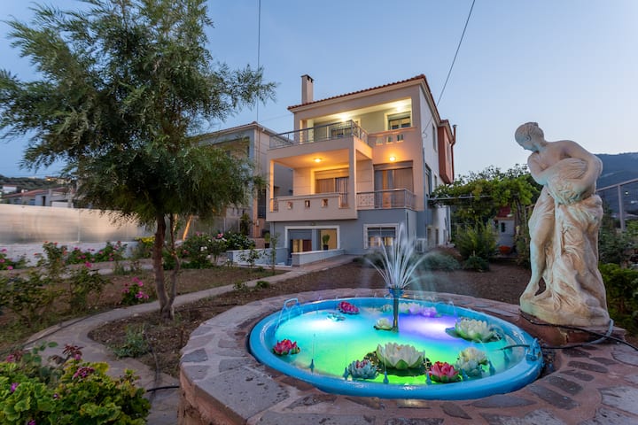Three-storey villa and illuminated garden fountain in Vareia, Mytilini
